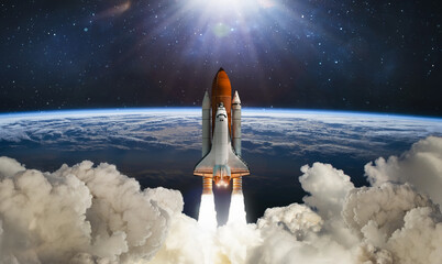 Space shuttle flight in space. Rocket launch. Earth planet and clouds space wallpaper. Elements of this image furnished by NASA