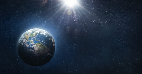 Earth planet in space. Blue marble. Space wallpaper with sun light and stars. Elements of this...
