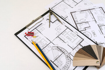 paint color samples with drawing instruments on house plan project