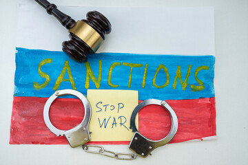 The inscription of the sanction on the flag of Russia for its attack on Ukraine and territory