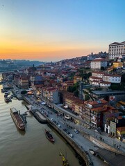 Obraz premium Porto view from Ponte Luis I bridge. Ribeira charming area view from bridge. Douro river. Old medieval town in northern Portugal. Down town. Sunset twilight in city. Rooftop view.