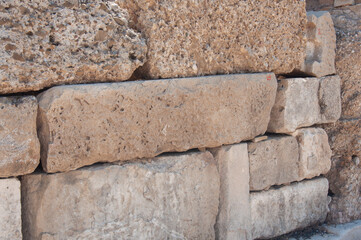 Textured background. Big beige stones outdoors