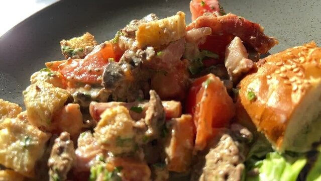 Hot beef liver salad with tomato sauce. High quality 4k footage