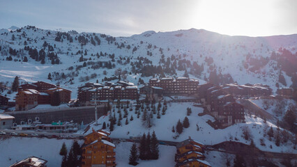 Aerial panorama of Chalets in the Meribel village, on the top of the valley in the french Alps. Visible houses and condominiums for skiers.