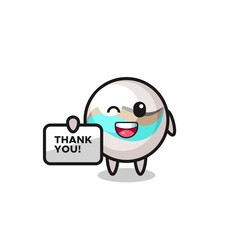 the mascot of the marble toy holding a banner that says thank you