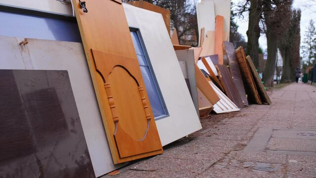 Pile of Old Furniture and Household Goods Dumped on the Street Prepared for Bulk Item Curbside Pickup Collection by City Services