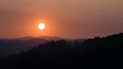 Orange sunset over landscape background