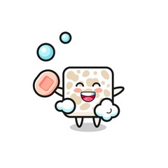 tempeh character is bathing while holding soap
