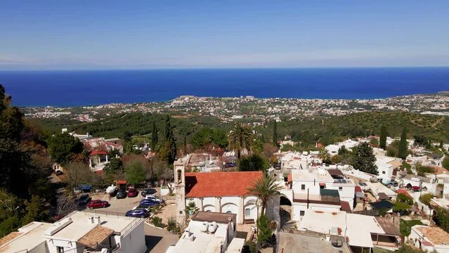 Aerial 4k view of fantastic Karmi Village in North Cyprus surrounded with amazing green nature and picturesque landscape of Kyrenia City.