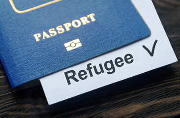 Refugee passport on table at border control in Europe, Ukraine war concept