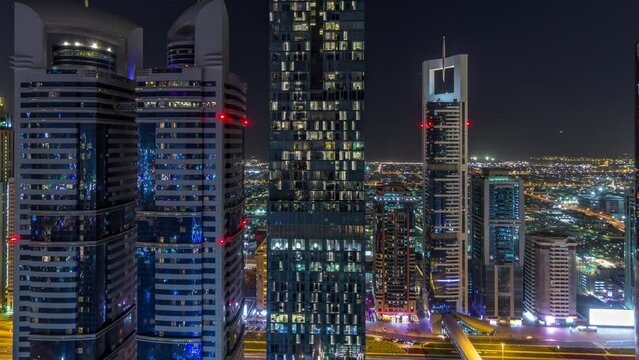 Skyline view of the buildings of Sheikh Zayed Road and DIFC night timelapse in Dubai, UAE.