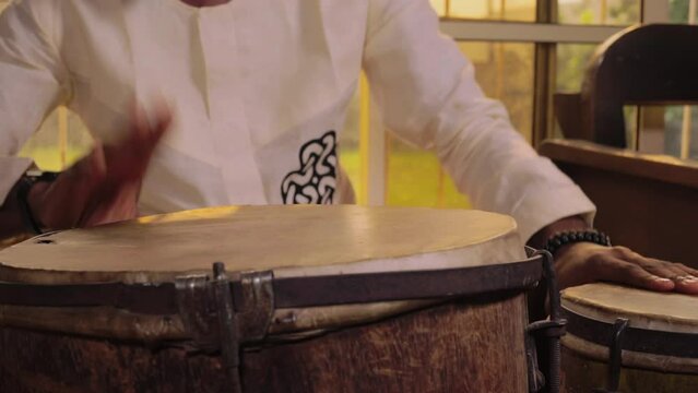 Man Playing African Drums