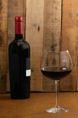 Bottle of red wine and glass of wine