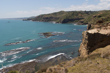 Fototapeta na wymiar Marine Landscape. The view of rocky coastline at West Coast near Auckland, New Zealand.