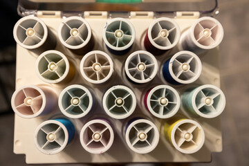 different colors of thread in an organized case