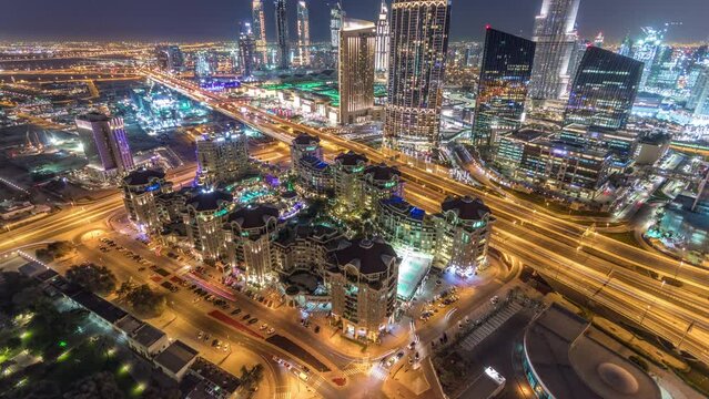 Dubai downtown skyline night timelapse with mall and road traffic, UAE