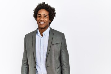 Young african american man wearing business jacket over isolated white background looking positive and happy standing and smiling with a confident smile showing teeth