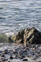 wave crashing intro rocks on pacific northwest beach