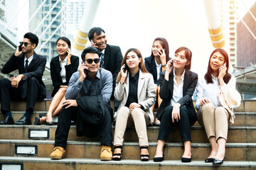 Close up of businessmen and businesswomen using smartphone, business communication concept
