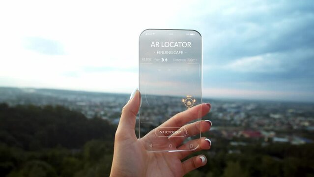 Close up hands woman hold transparent phone screen with AR Locator. Concept of futuristic device, helping search places in unknown city to sleep, eat. Global smart network. Future digital world
