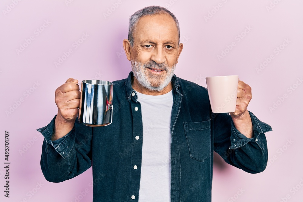 Canvas Prints Handsome senior man with beard holding coffee and milk smiling with a happy and cool smile on face. showing teeth.