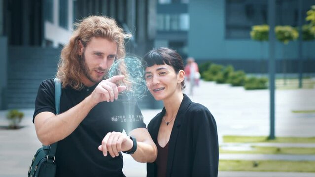 Man and woman search place to travel using smart watch to project augmented reality hologram world. Tourism app device. Future digital concept. Global connection and internet network - Powered by Adobe