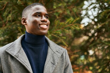 Young african american man smiling happy standing at the park.