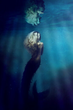 Underwater goddess. A gorgeous mermaid underwater - ALL design on this image is created from scratch by Yuri Arcurs team of professionals for this particular photo shoot.