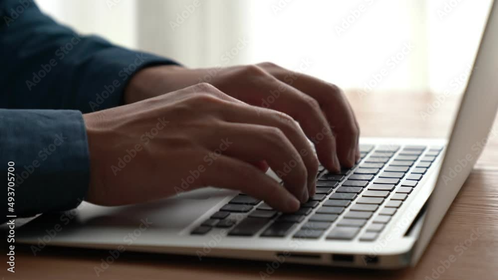 Wall mural businessman hand work on capable laptop computer at office table close up shot and selective focus a