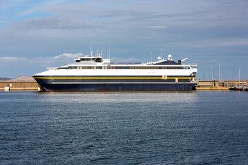 big cruise ship in the mediterranean sea for summer holidays in the port of the islands