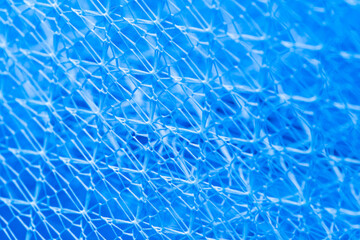 background texture Closeup of blue netting. Abstract background with intersection of nylon threads...