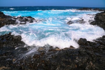 waves breaking on the rocks