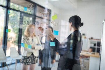 Achieving their dreams as a team. Shot of businesswomen brainstorming in an office.