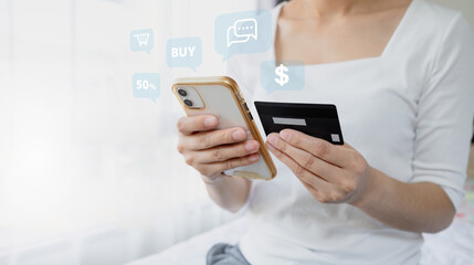 Woman hand holding credit card and smartphone for paying online using banking service. Online shopping concept