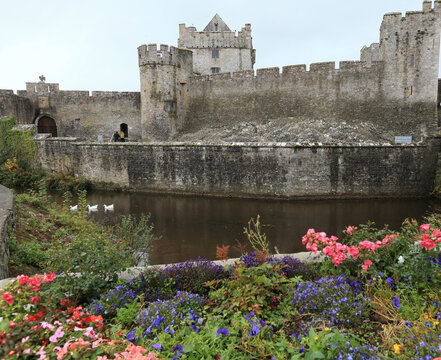  historic ruins of Cahir Castle and its moat in Ireland