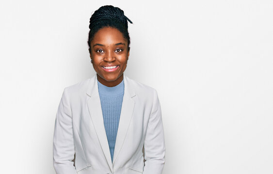 Young african american woman wearing business clothes with a happy and cool smile on face. lucky person.