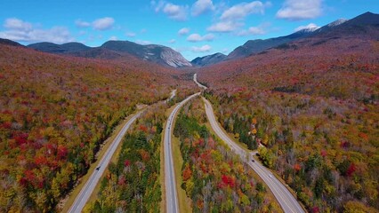 Franconia Notch State Park and Interstate Highway I-93 aerial view facing Franconia Notch in White Mountain National Forest with fall foliage, Town of Lincoln, New Hampshire NH, USA.