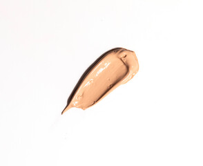 Creamy foundation smeared on white background. Isolated. Beauty and fashion conception. Liquid cream cosmetic,
