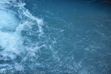 Naklejka na ściany i meble water surface of a blue river