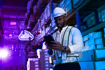 Black male staff working checking stock on cloud computing system at modern innovative logistic warehouse, Smart logistic factory innovation concept - obrazy, fototapety, plakaty