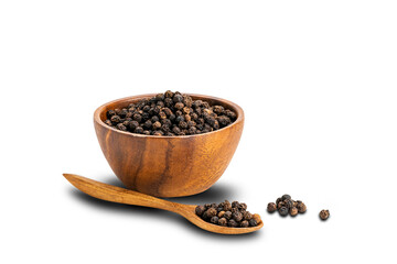 Pile of black pepper seeds with black pepper seeds in wooden spoon and in wooden cup on white background.
