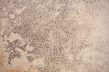 The cement wall background is getting old and dirty