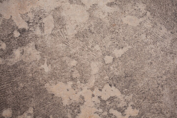 The cement wall background is getting old and dirty