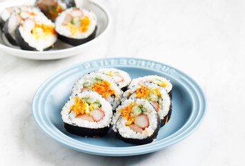 Korean Roll Gimbap (Kimbob or Kimbap) made from Steamed White Rice (Bap) and Various other Ingredients, Such As Kyuri, Carrot, Sausage, Crab Stick, or Kimchi and Wrapped with Seaweed Laver