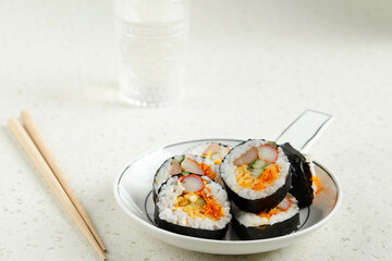 Korean Roll Gimbap (Kimbob or Kimbap) made from Steamed White Rice (Bap) and Various other Ingredients, Such As Kyuri, Carrot, Sausage, Crab Stick, or Kimchi and Wrapped with Seaweed Laver.