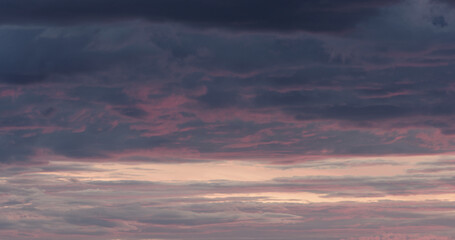 Purple clouds last minutes before sunset