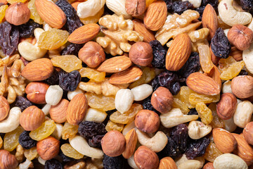 mixed nuts with dried fruits as background