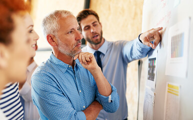 Considering their options. Shot of businesspeople working together in an office.