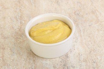 Organic mustard sauce in the bowl