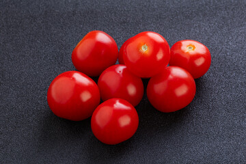 Ripe juicy cherry tomatoes heap